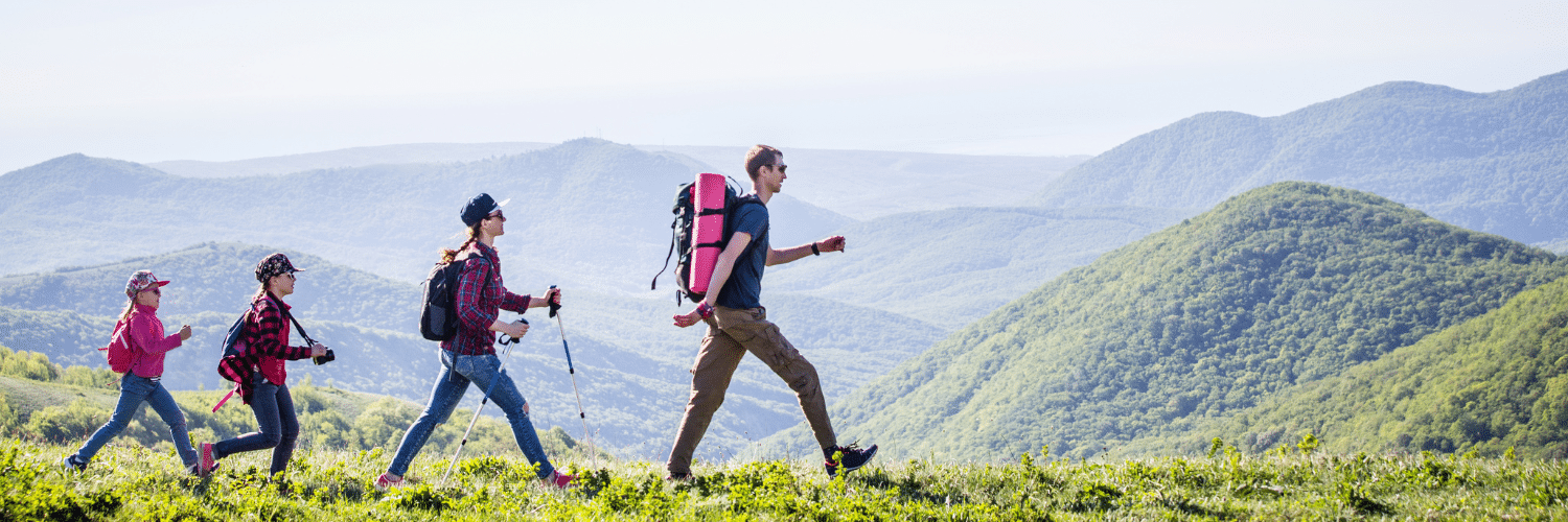 family hiking on a hill