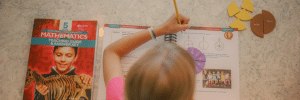 Homeschool student working on Apologia Math, Level 5