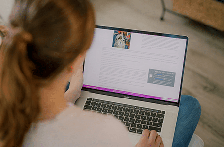 Homeschool student taking a self-paced course at home on a laptop