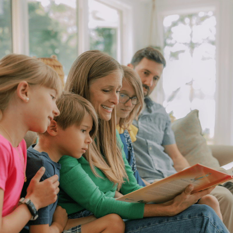 Family learning the Bible together with The Word in Motion Bible curriculum