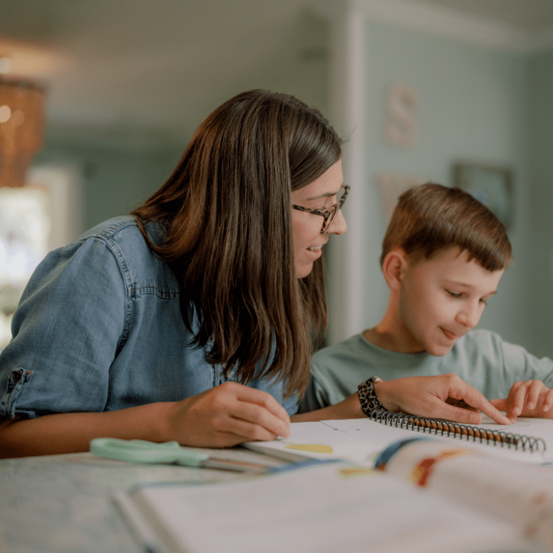 Homeschool mom teaching her son science at home