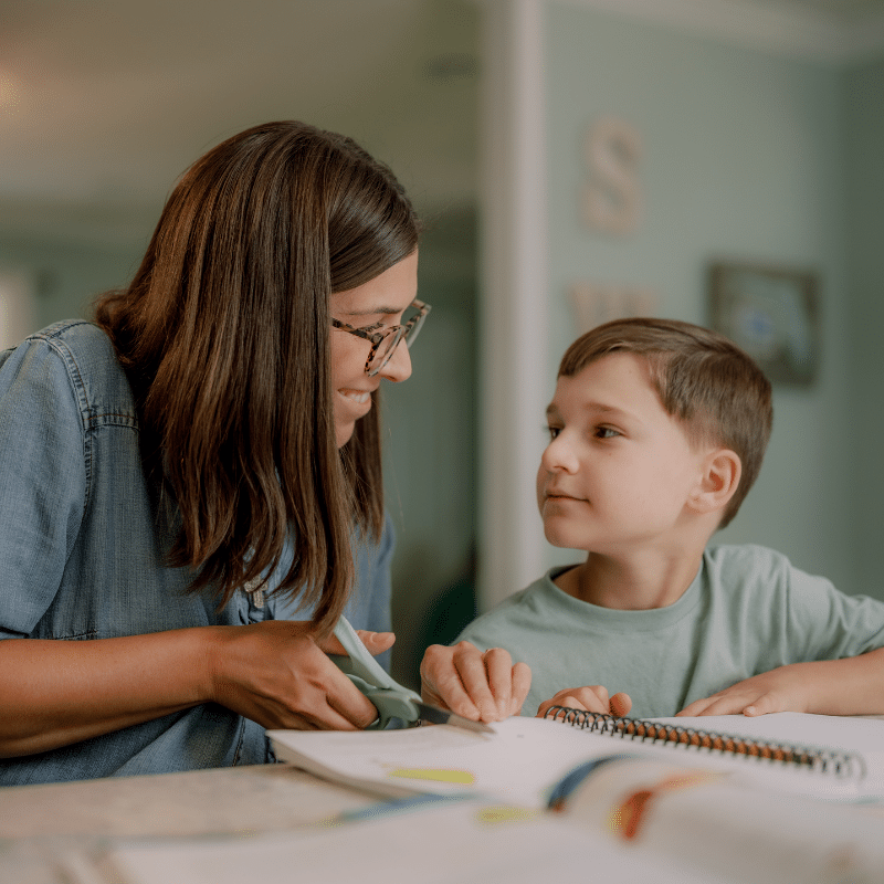 Homeschool mom teaching her son science at home