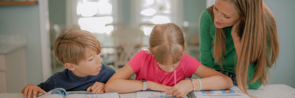 Mom homeschooling her children together