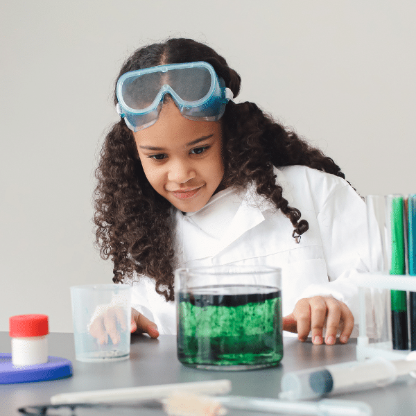 Science fair student working on a chemistry project.